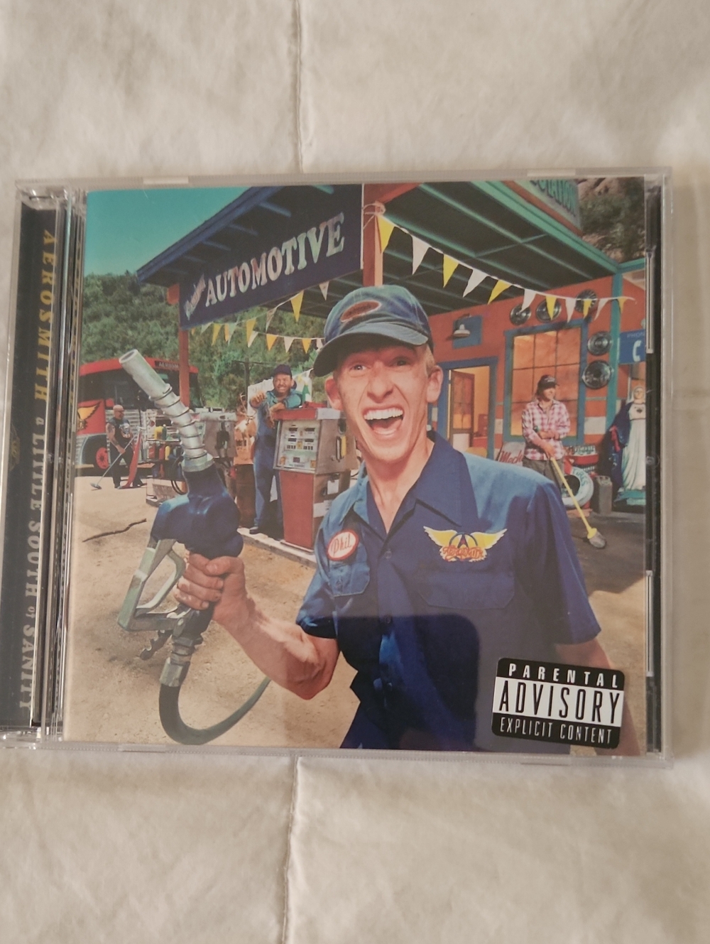 Aerosmith CD Cover with Blue Uniform and Cap